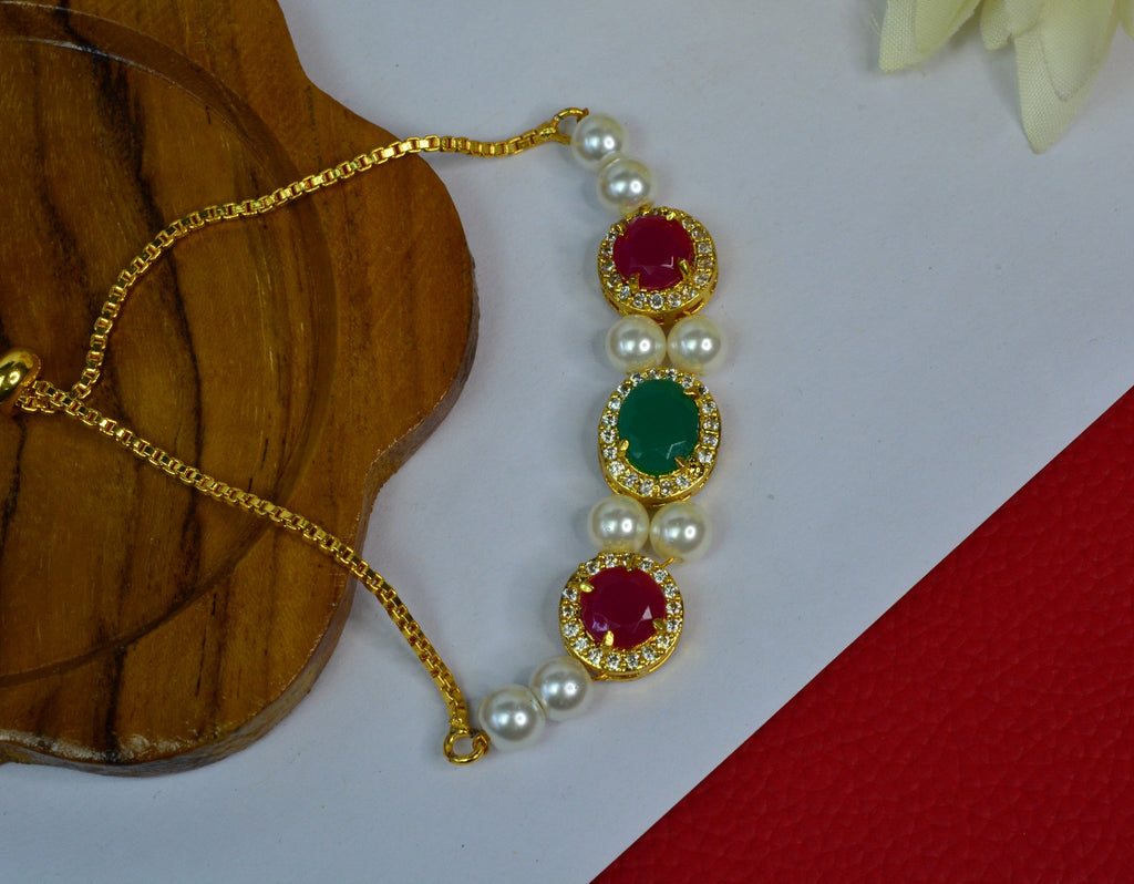 Jewelopia Ruby/Emerald Diamond Studded Gold Plated With Pearl Bracelet Adjustable for Women and Girls